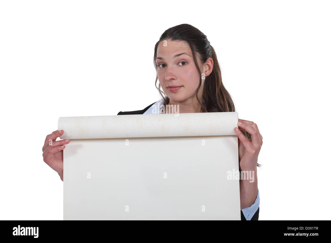 Woman unrolling a roll of paper Stock Photo