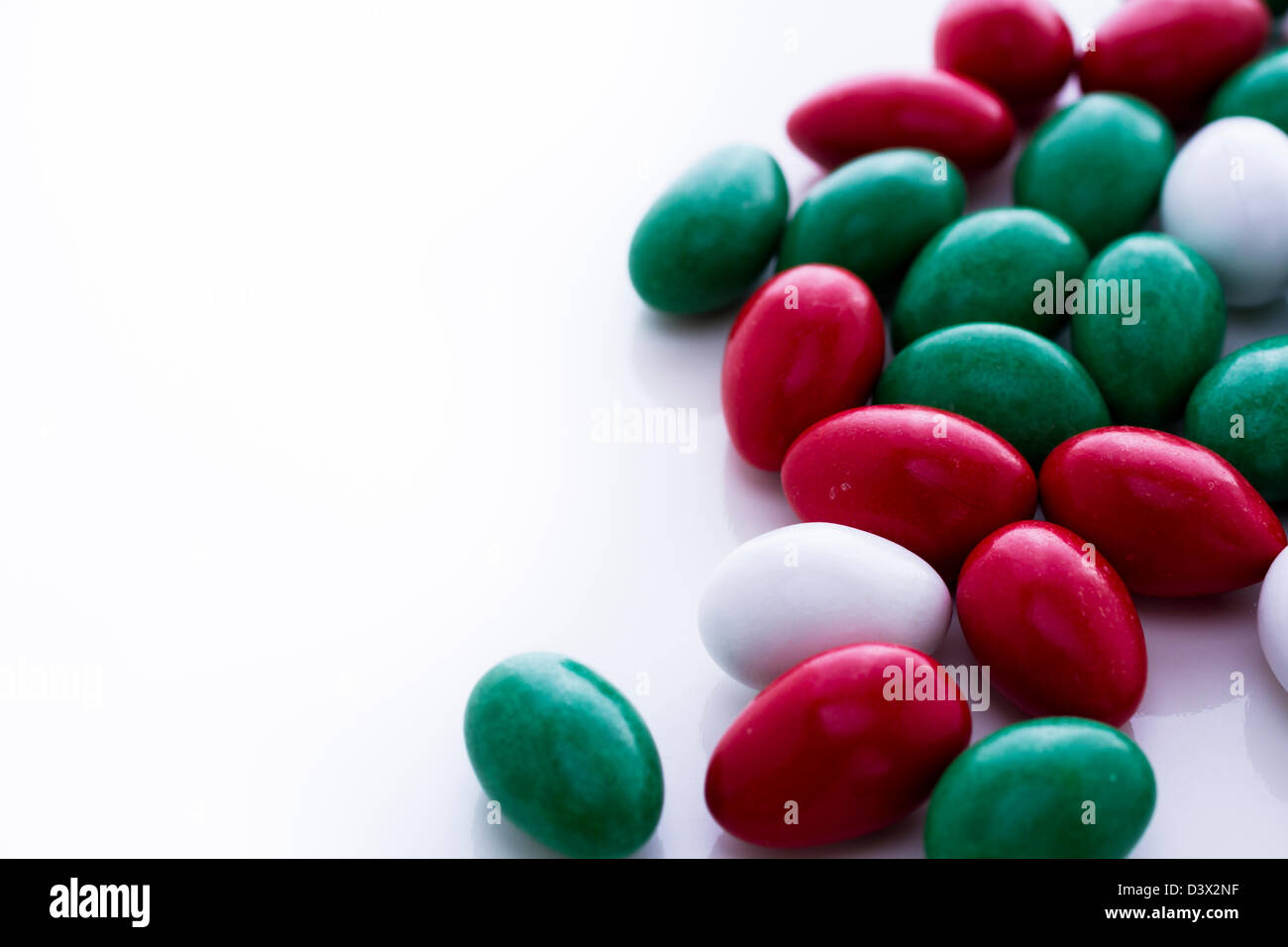 Colorful red, green and white candies on white background Stock Photo Alamy