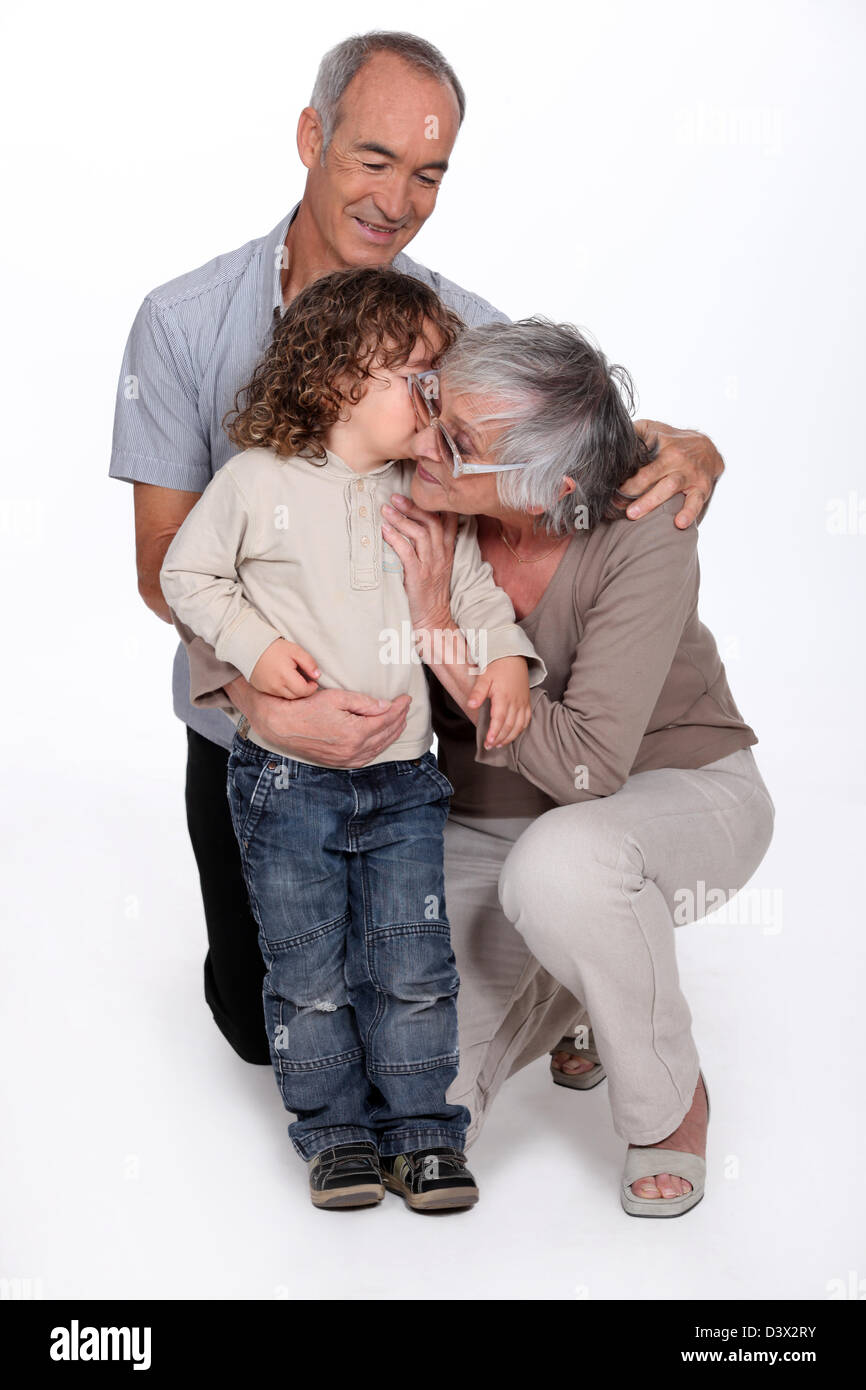 Grandparents with granddaughter Stock Photo