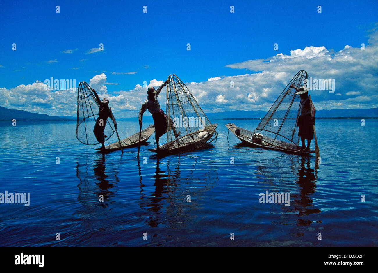 Intha fisherman rowing boat with leg, Inle Lake, Myanmar Stock Photo