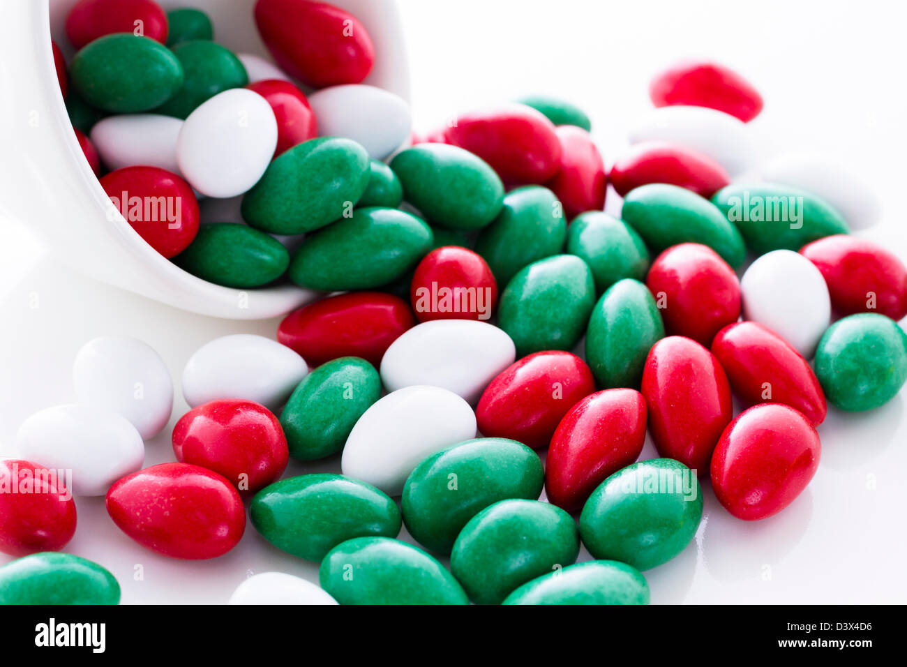 Colorful red, green and white candies on white background Stock Photo Alamy