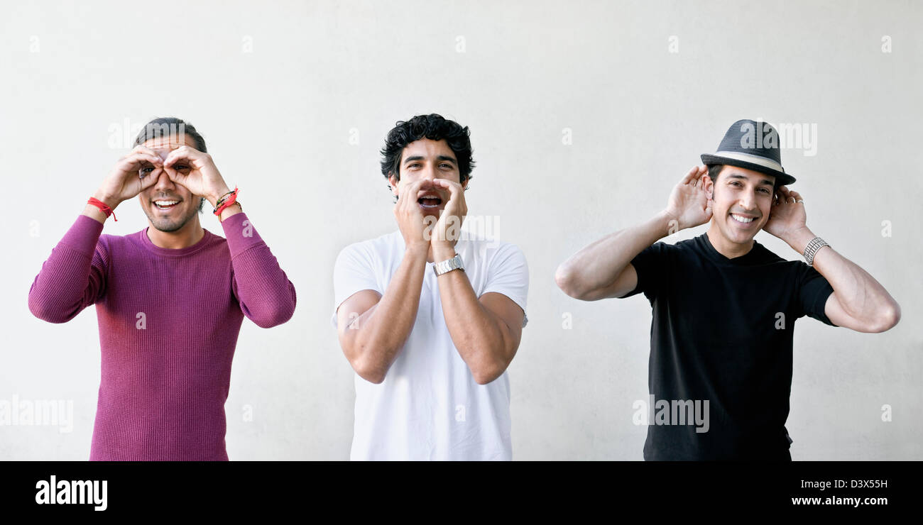 3 male friends demonstrating the saying Hear no evil, see no evil, speak no  evil Stock Photo - Alamy