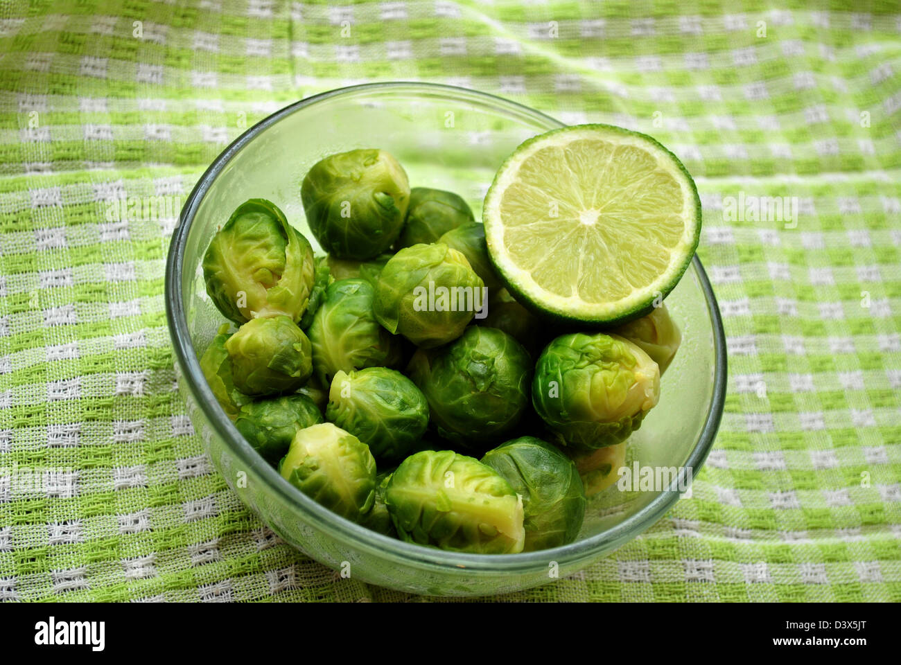 Brussel Sprouts with a Slice of Lime Stock Photo