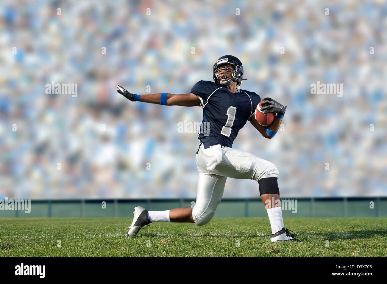 African American football player poised on field Stock Photo Alamy