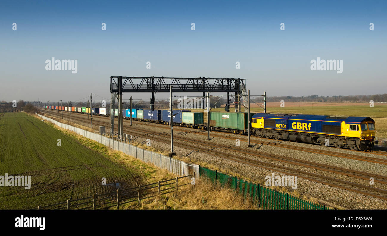 Bound for Felixstowe from Trafford Park GBRf Class 66 701 heads south along the WCML at Fisherwick, Staffordshire on 19 February Stock Photo