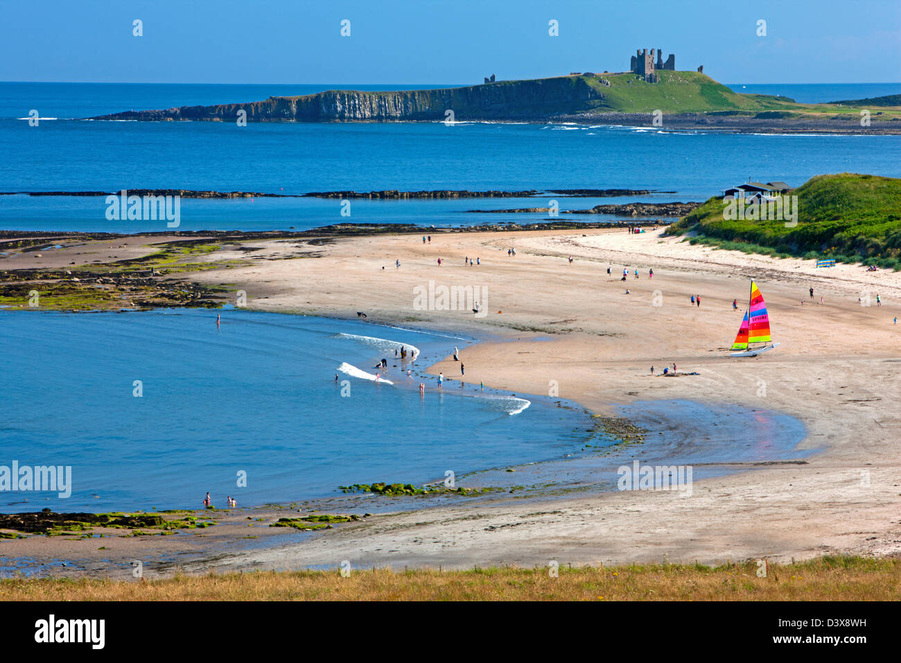 View from Low Newton-by-the-Sea towards Dunstanburgh Castle, Northumberland Stock Photo
