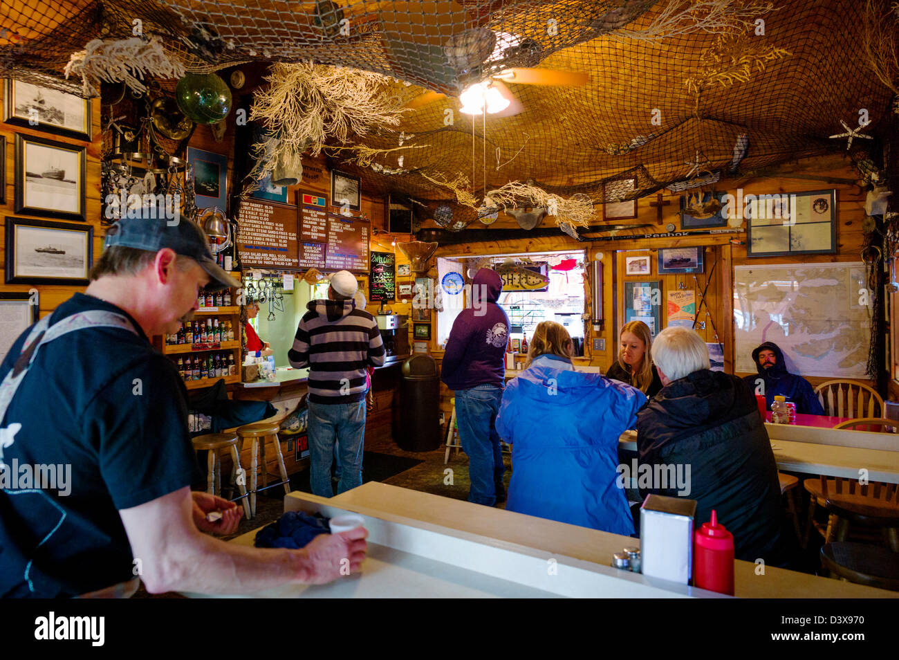 Visitors dining inside the Swiftwater Seafood Cafe, Whittier, Alaska