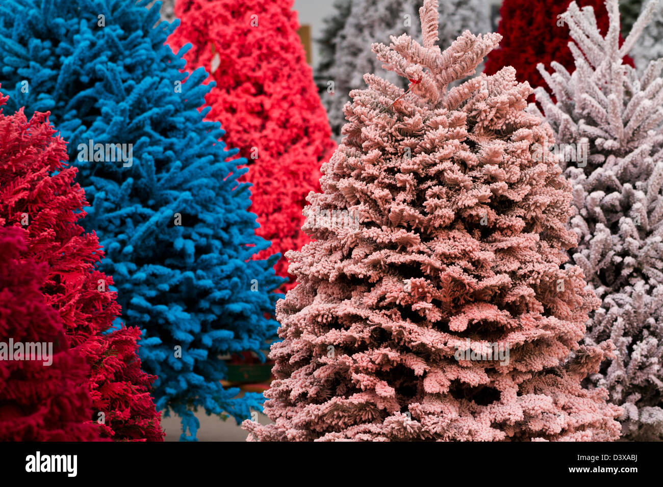 Flocked Christmas Tree with multi colors Stock Photo Alamy