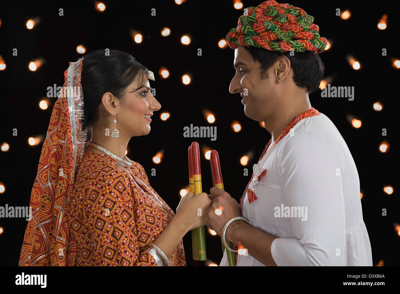 Couple performing Dandiya Raas at Navratri Stock Photo - Alamy