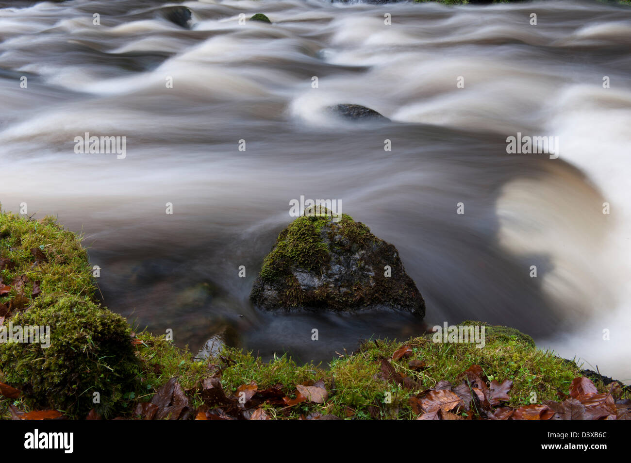 Fast flowing river following a storm. Cumbria, UK Stock Photo