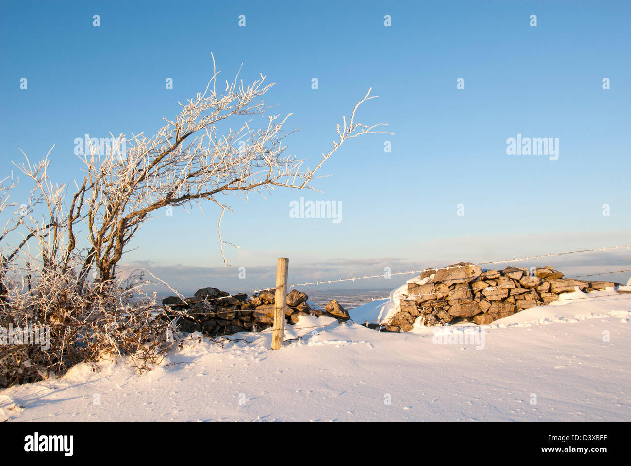 Stone wall and snowdrift, England, United Kingdom, Europe Stock Photo