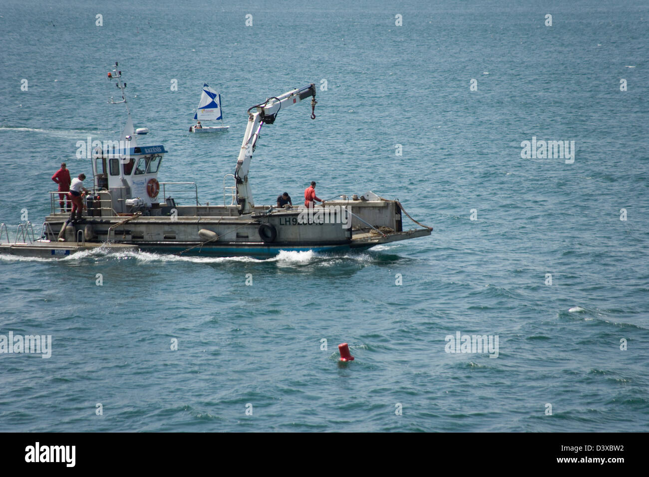 Fishing boat just off the beach of Etretat, Normandy, France Stock ...