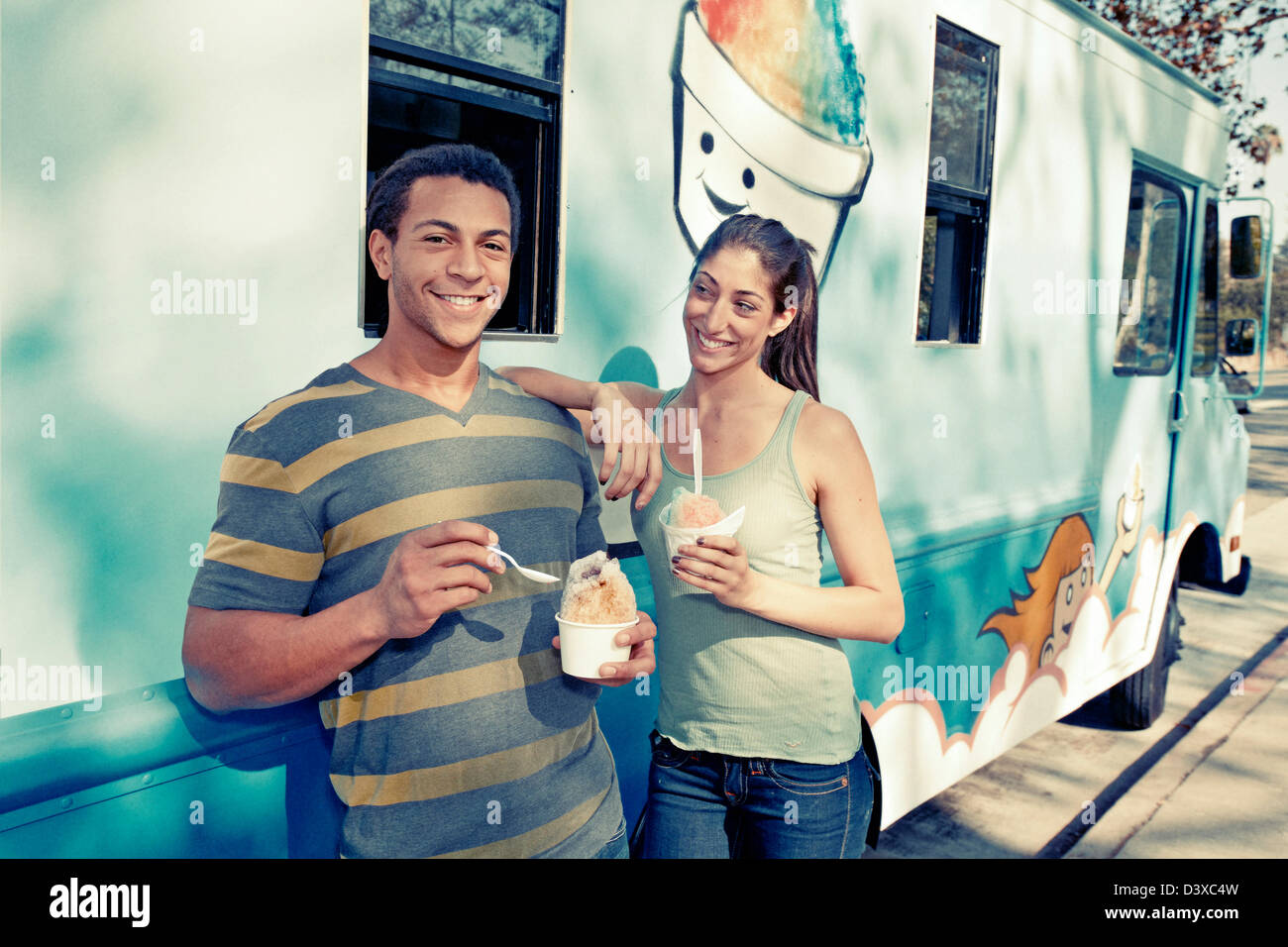 Couple eating ice cream from truck Stock Photo
