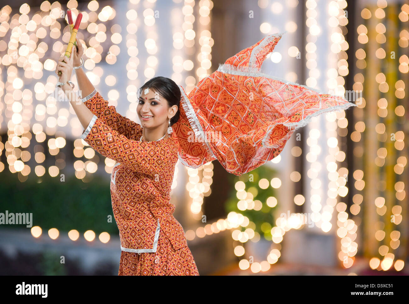 Woman performing Dandiya Raas at Navratri Stock Photo Alamy