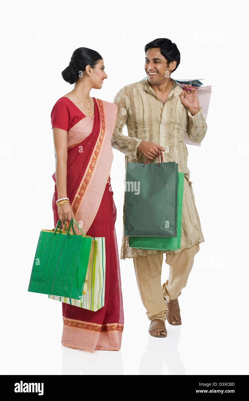 Bengali couple carrying shopping bags Stock Photo Alamy