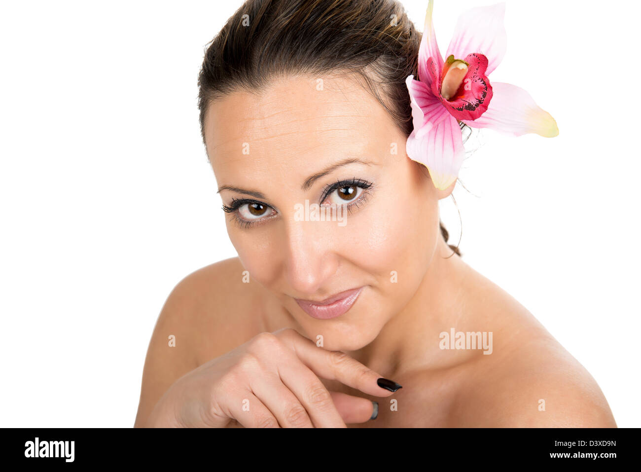 Beautiful woman with flower at beauty spa salon. Stock Photo