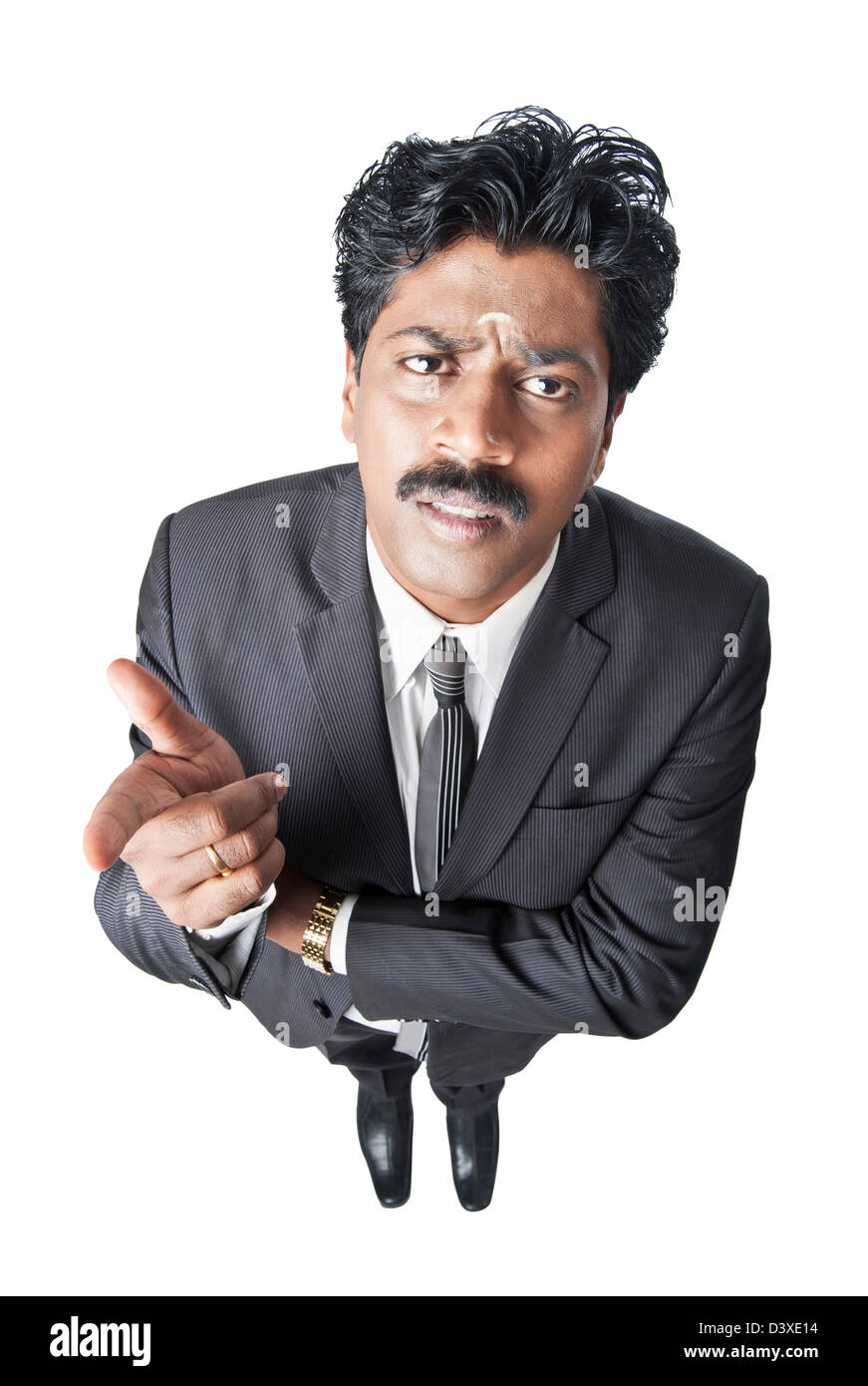South Indian businessman gesturing and looking serious Stock Photo