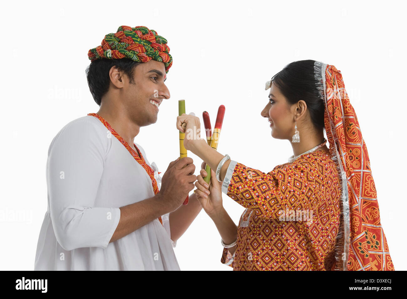 Couple performing Dandiya Raas at Navratri Stock Photo - Alamy