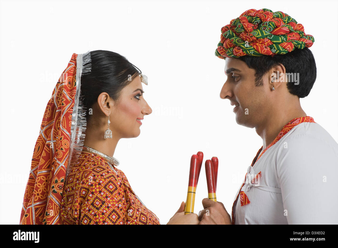 Couple performing Dandiya Raas at Navratri Stock Photo - Alamy