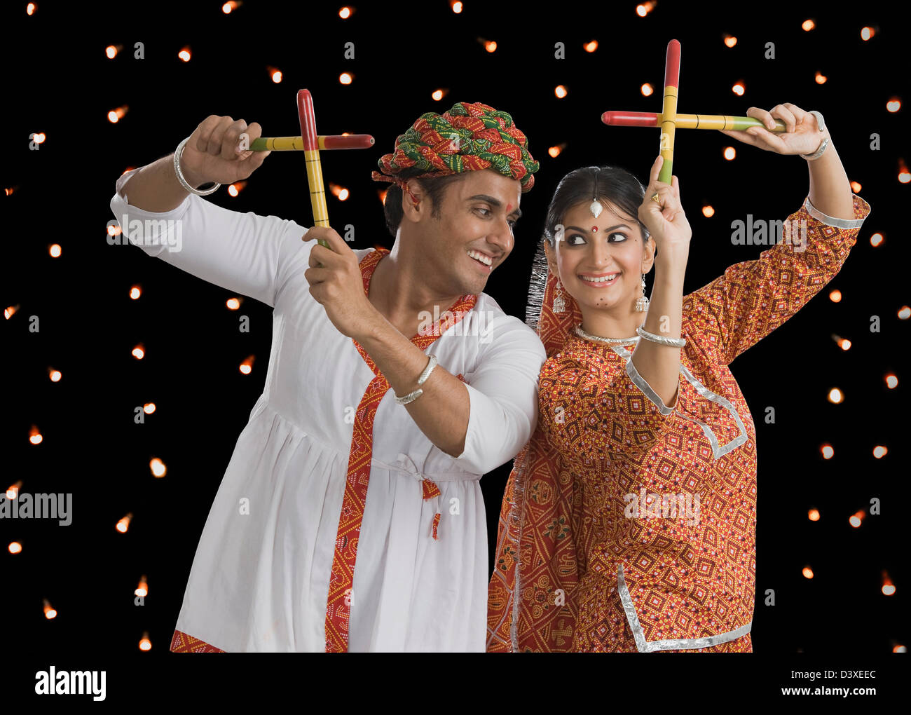 Couple performing Dandiya Raas at Navratri Stock Photo - Alamy