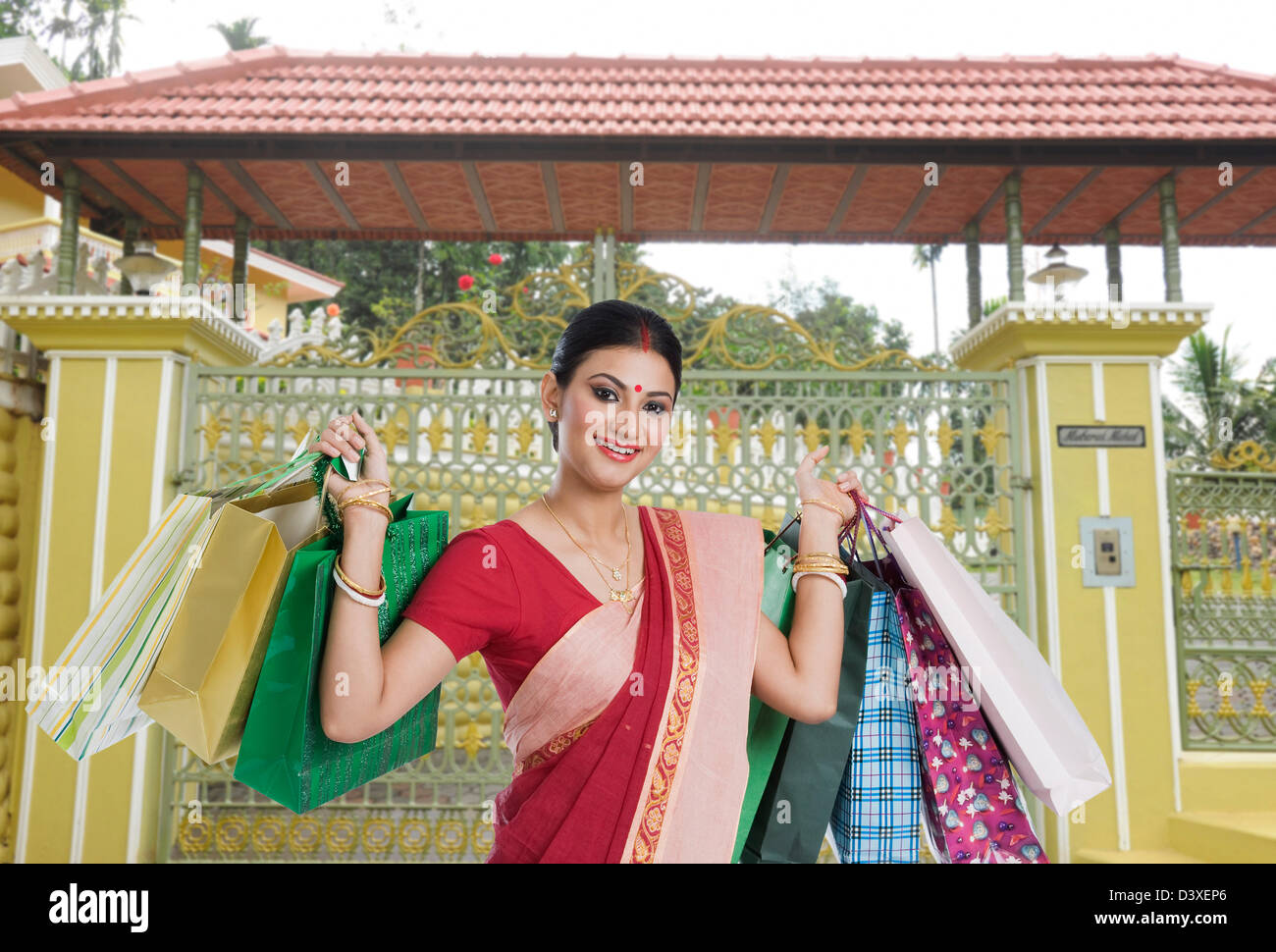 Bengali woman carrying shopping bags Stock Photo Alamy