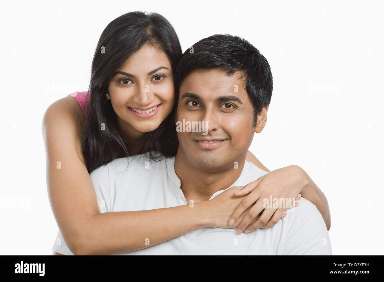 Woman hugging her husband from behind Stock Photo - Alamy