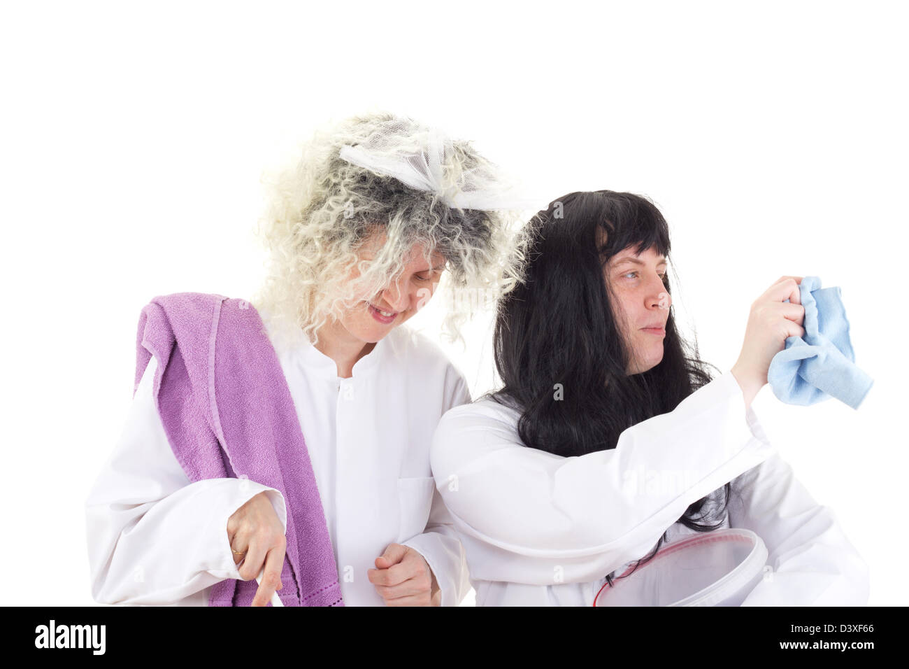 Female cleaners in white work coats Stock Photo