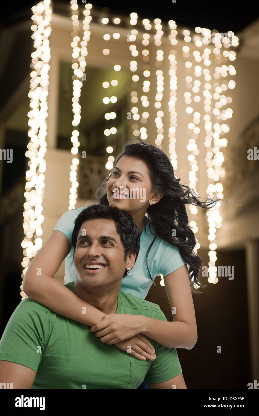 Woman hugging her husband from behind Stock Photo - Alamy