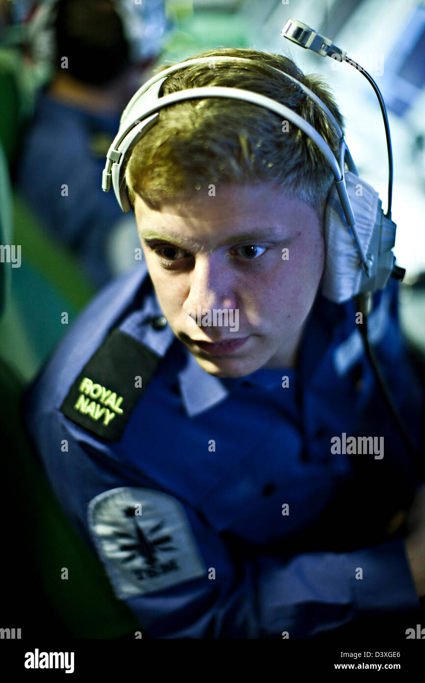 Crew man in headset, communications on Nuclear Submarine HMS Talent Stock Photo