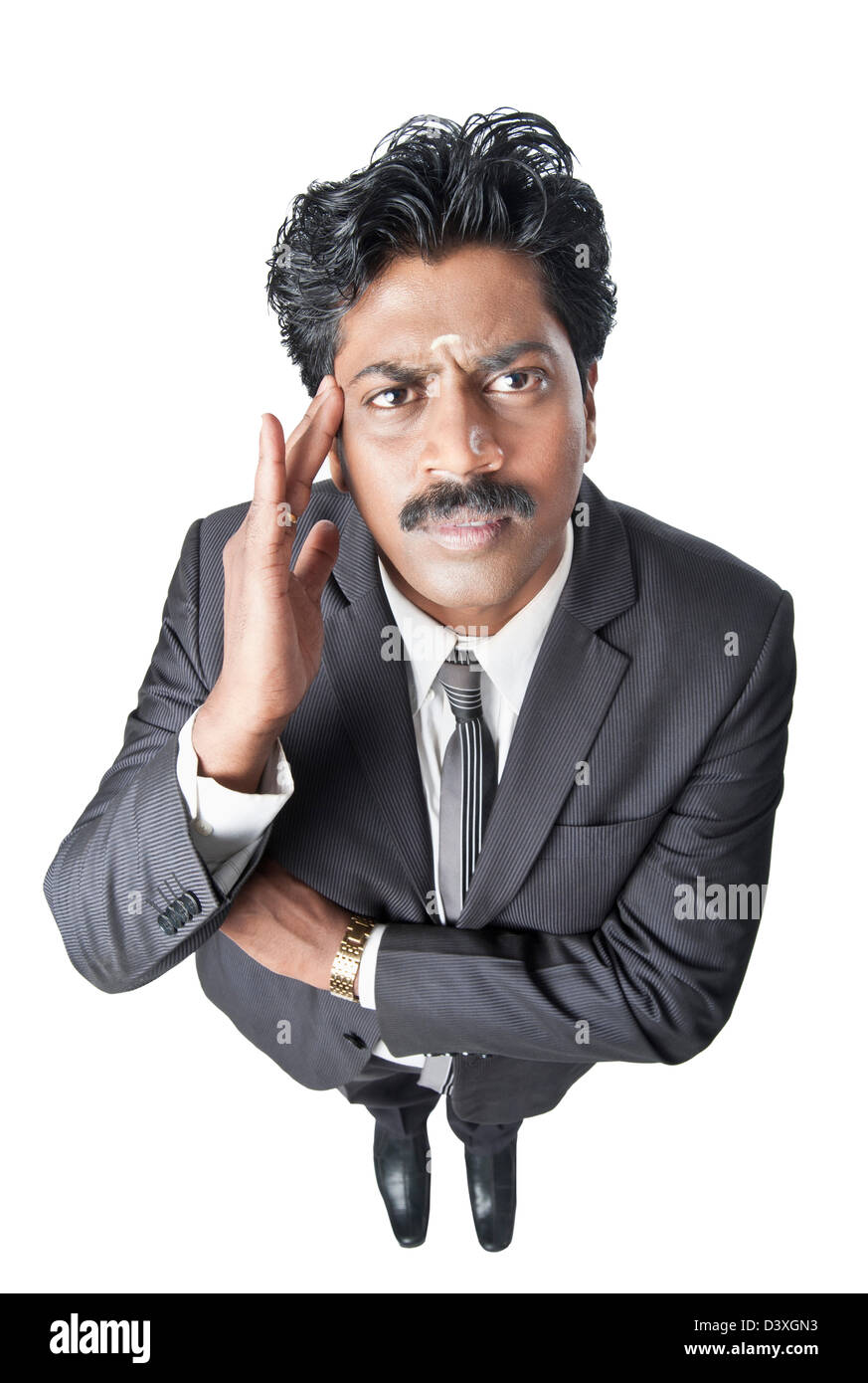 South Indian businessman gesturing and looking serious Stock Photo