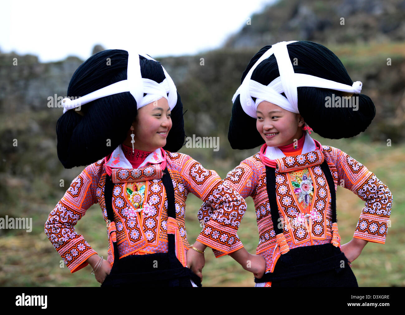 A Long Horn Miao teenage girls at the Tiao Hua festival in Guizhou. Stock Photo