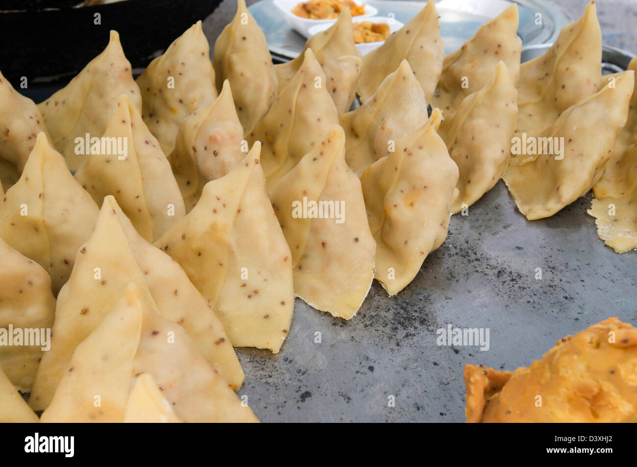 Closeup of traditional Indian snack 'samosa' at a food stall, Sohna