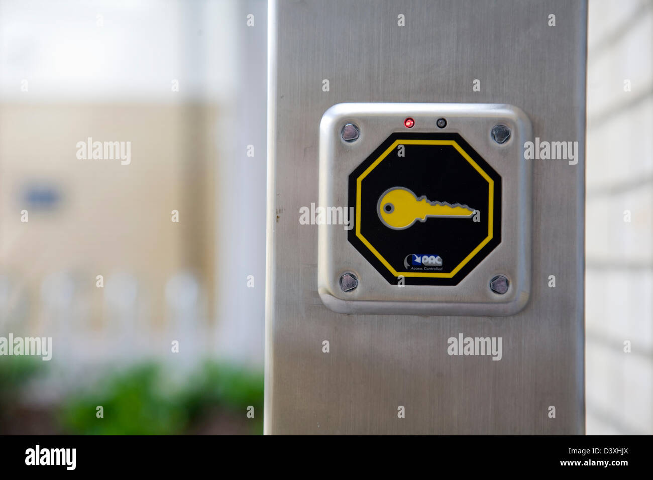 Key sign on security lock, external electronic entry pad. Stock Photo