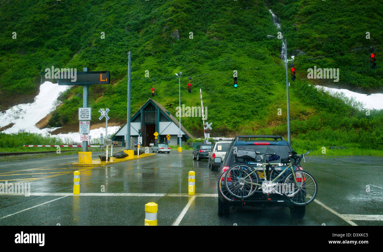 The Anton Anderson Memorial Tunnel under Maynard Mountain is shared by automobiles and the railroad.  Whittier to Portage Alaska Stock Photo