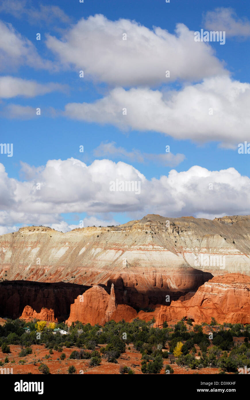 colorful rock formations under blue sky with cumulus clouds Stock Photo ...