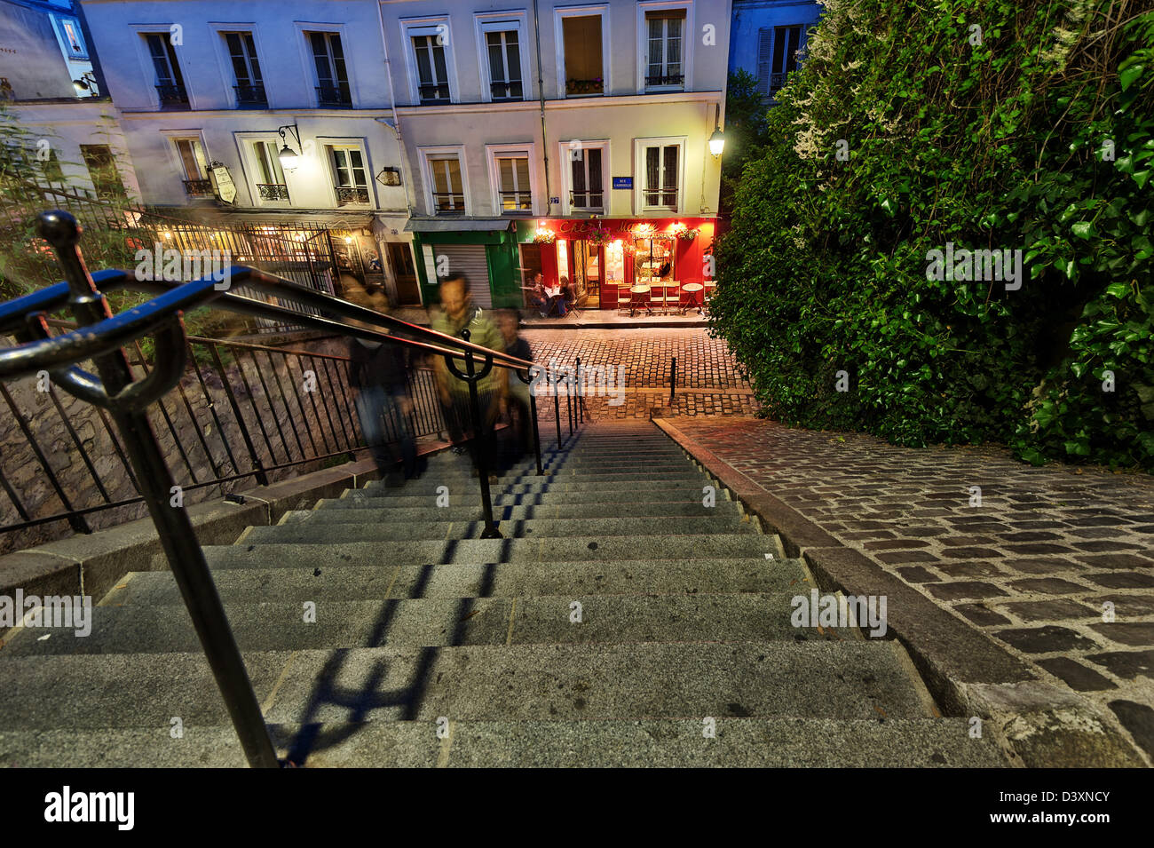 People climbing Stairs to Rue Gabrielle and restaurant “Chez Marie”, Montmartre, Paris, France Stock Photo