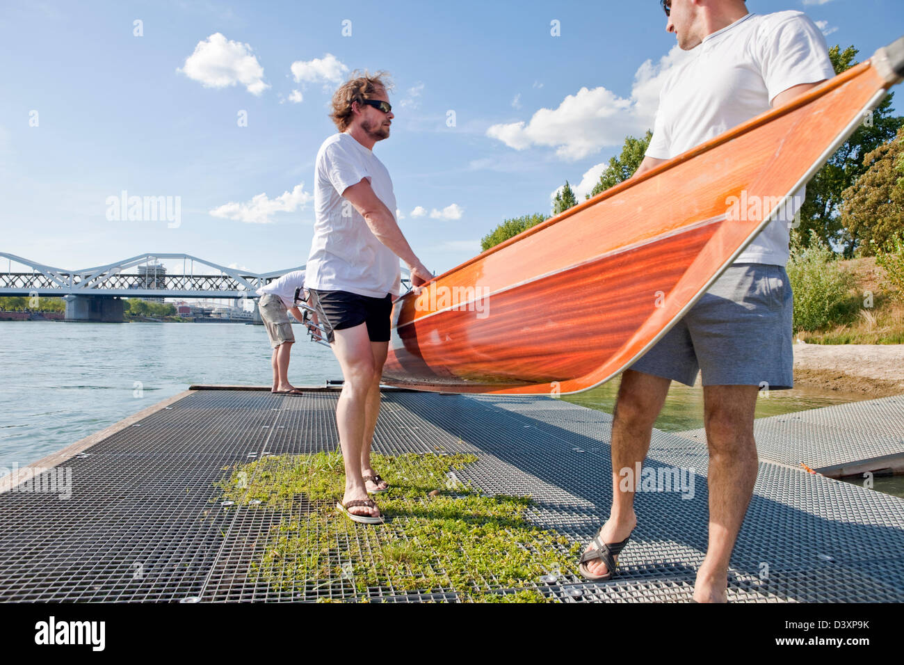 Teamwork Concept of Cooperation and Helping Hands in Rowing Sports Stock Photo