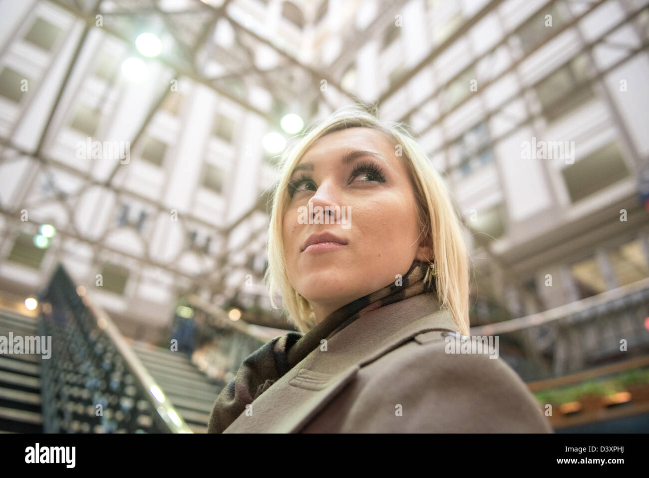 Woman in atrium of Old Post Office Building, Washington DC Stock Photo
