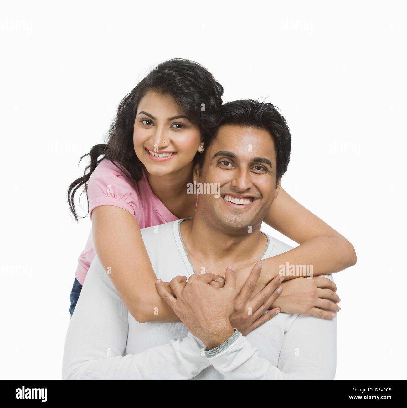 Woman hugging her husband from behind Stock Photo - Alamy