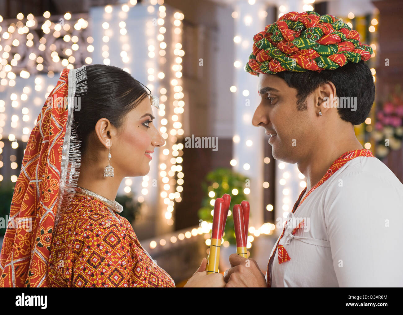 Couple performing Dandiya Raas at Navratri Stock Photo - Alamy