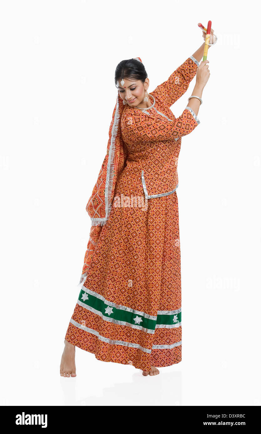 Woman performing Dandiya Raas at Navratri Stock Photo