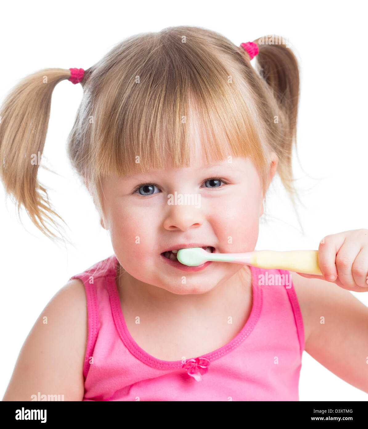 cute kid girl brushing teeth isolated on white background Stock Photo