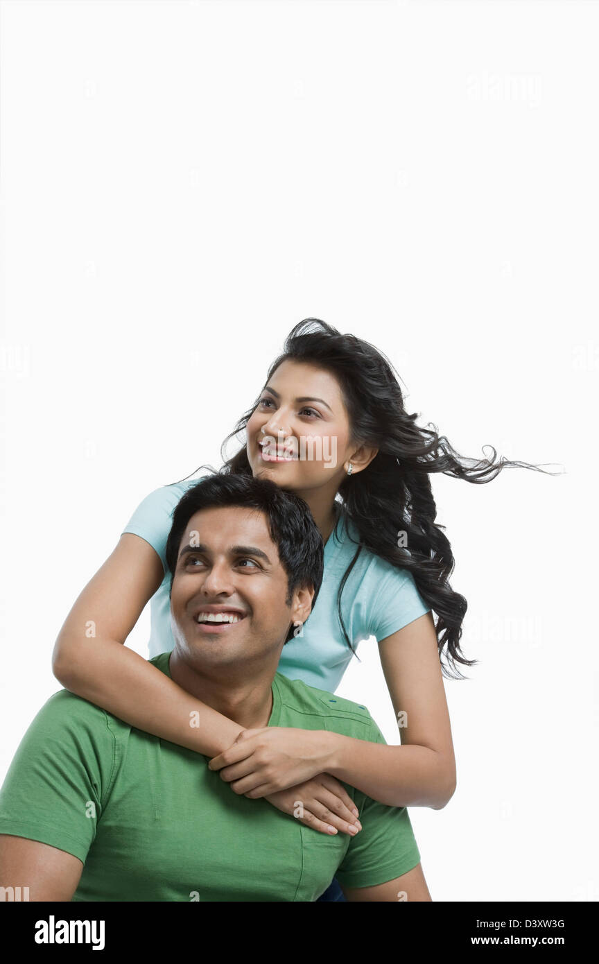 Woman hugging her husband from behind Stock Photo - Alamy
