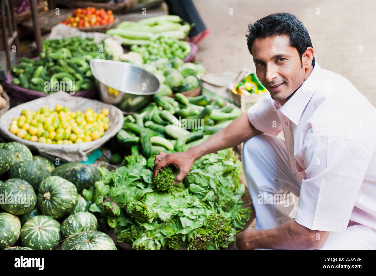 Man buying vegetables from a market stall, Sohna, Gurgaon, Haryana