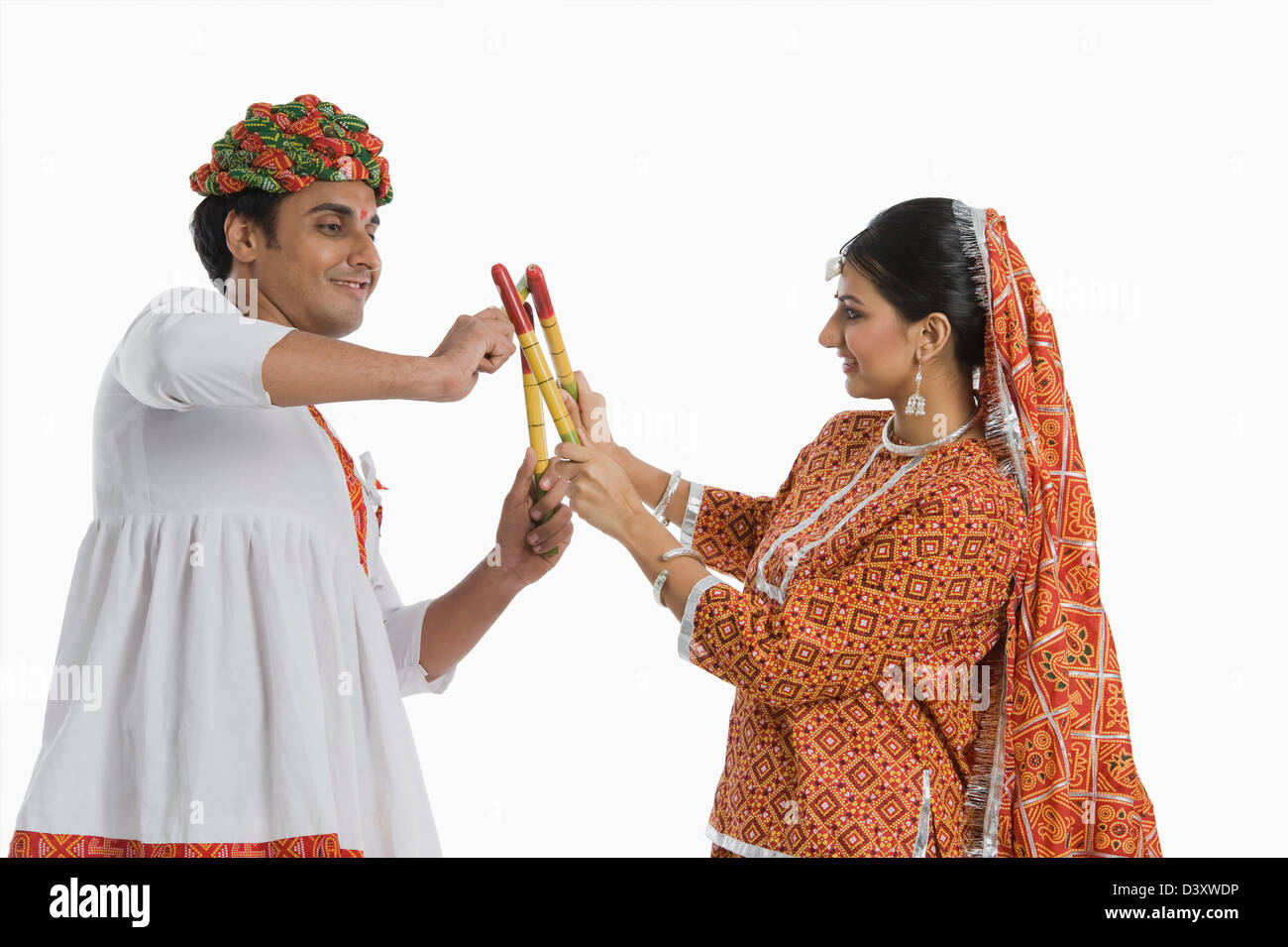 Couple performing Dandiya Raas at Navratri Stock Photo - Alamy