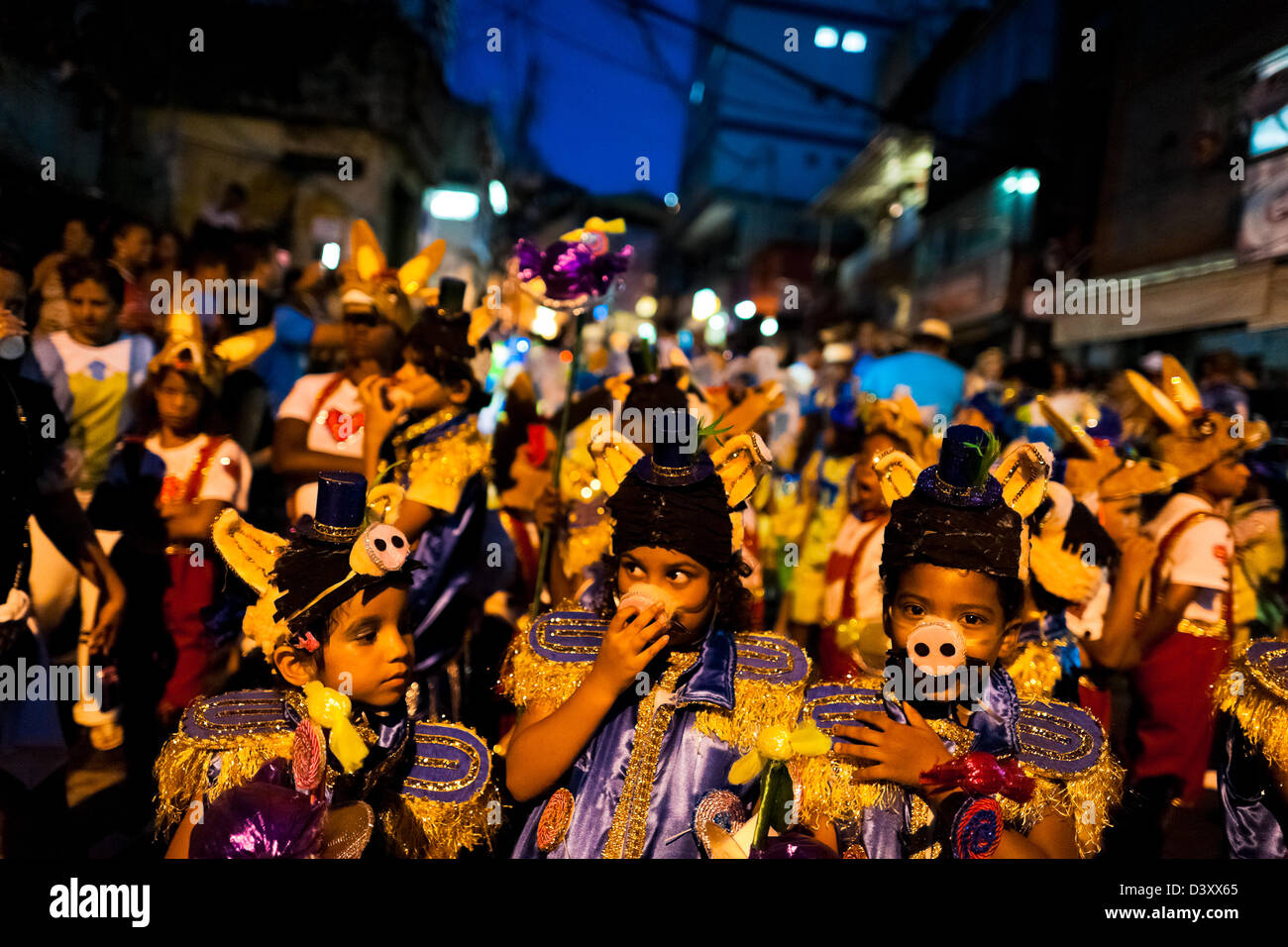 Brazilian children, with colorful costumes, take part in the Carnival parade in the favela of Rocinha, Rio de Janeiro, Brazil. Stock Photo