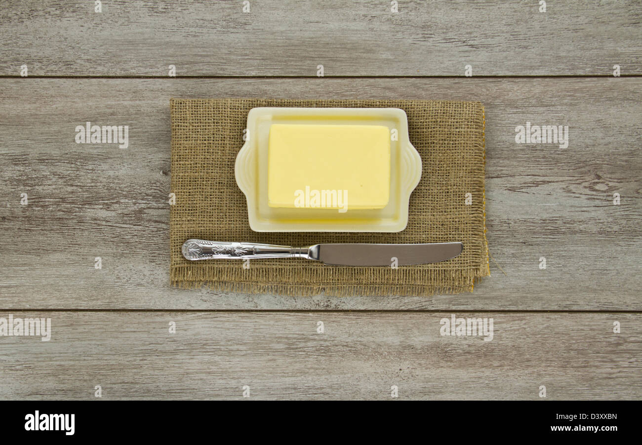 Butter on dish with knife Stock Photo
