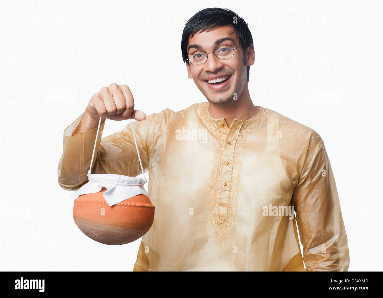 Bengali man carrying a pot of rasgulla Stock Photo Alamy