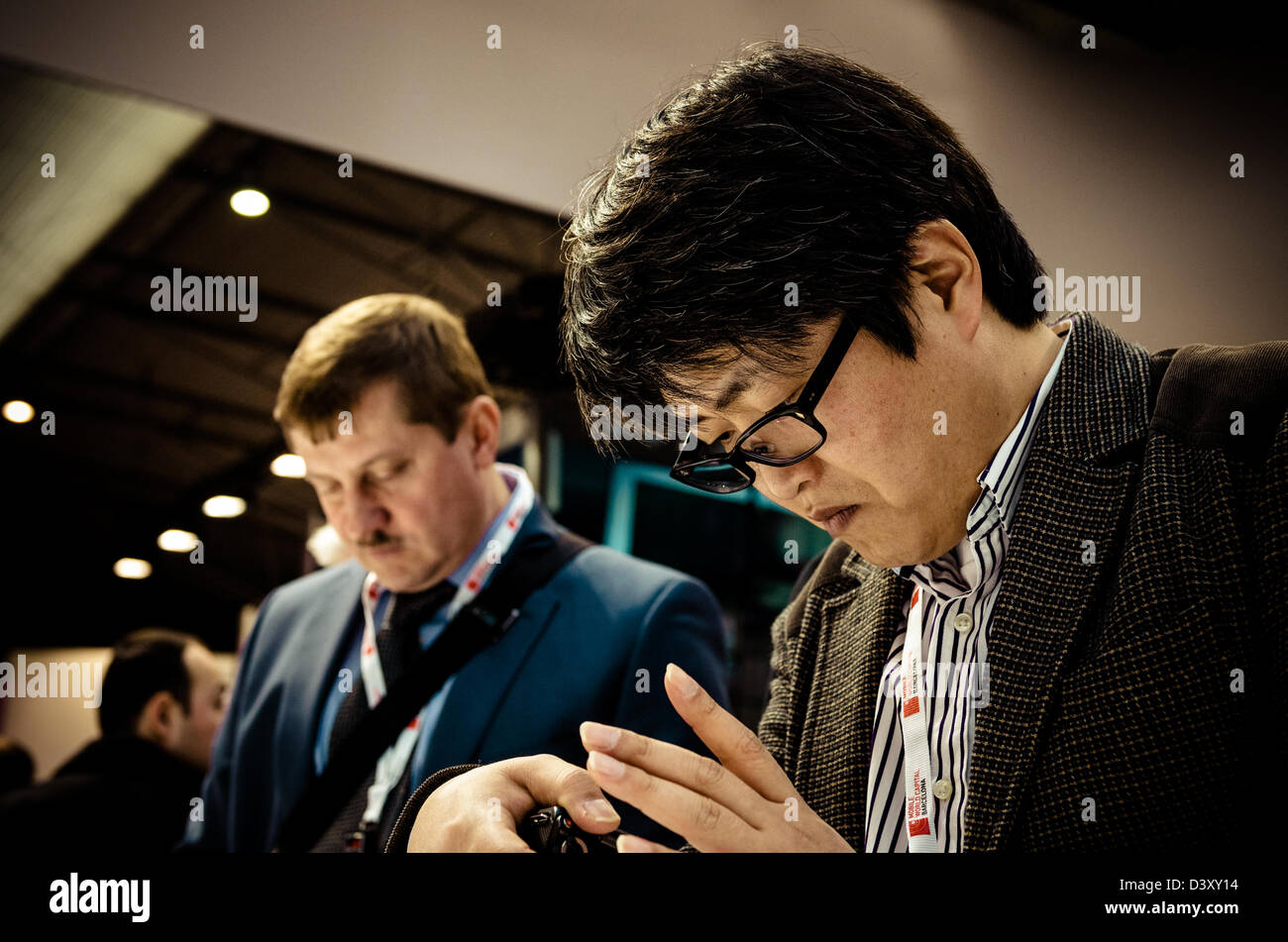 Barcelona, Spain. 26th Febraury 2013: About 70,000 visitors attend the Mobile World Congress 2013 and test the   newest mobile devices and smart phones, as pictured here at the Huawei stand.Credit: Matthi/Alamy Live News Stock Photo