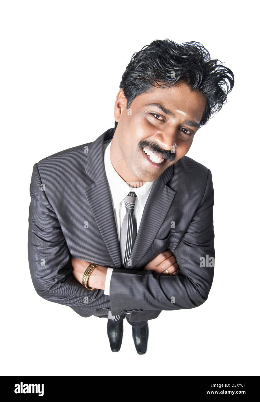 South Indian businessman standing with his arms crossed Stock Photo - Alamy
